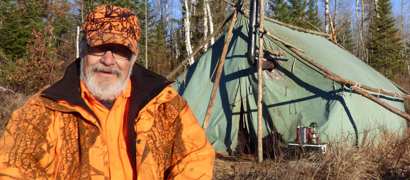 Doc sitting in front of his tent during the 2016 deer season.