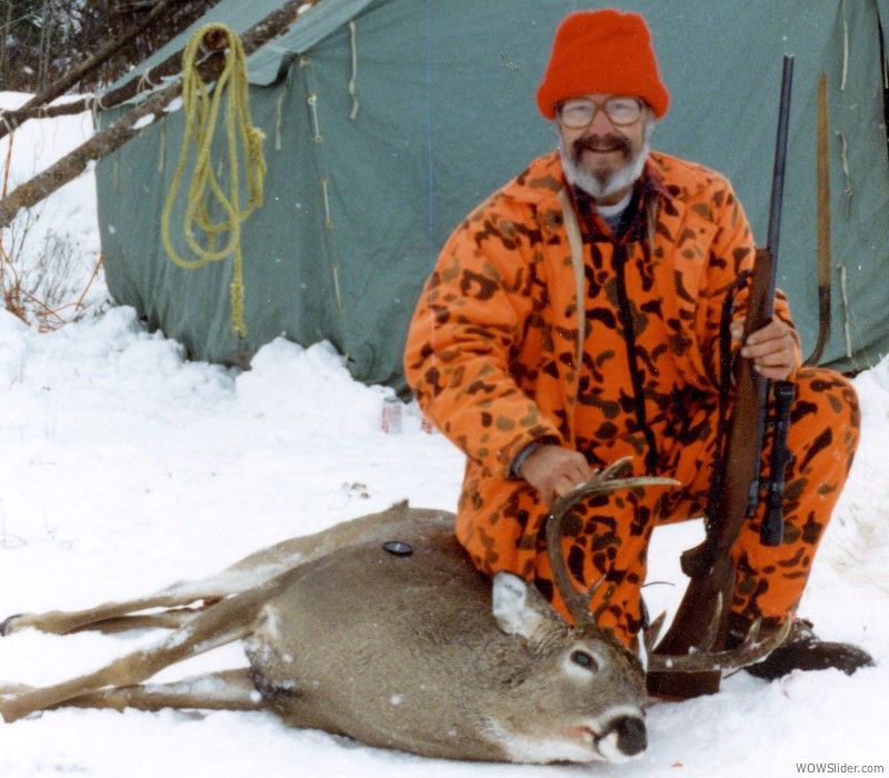Doc in front of his wall tent with the same buck.