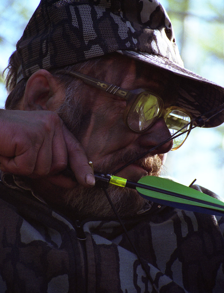 Closeup of Doc using a mechanical release. His bow is at full draw.