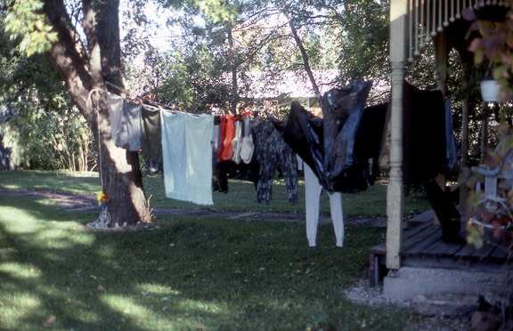 Doc's hunting clothes hanging on a clothes line outside.