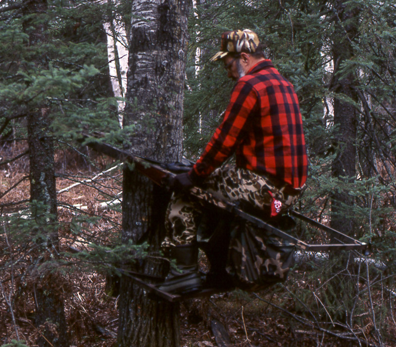 Doc demonstrating how to use a metal climbing treestand quietly.